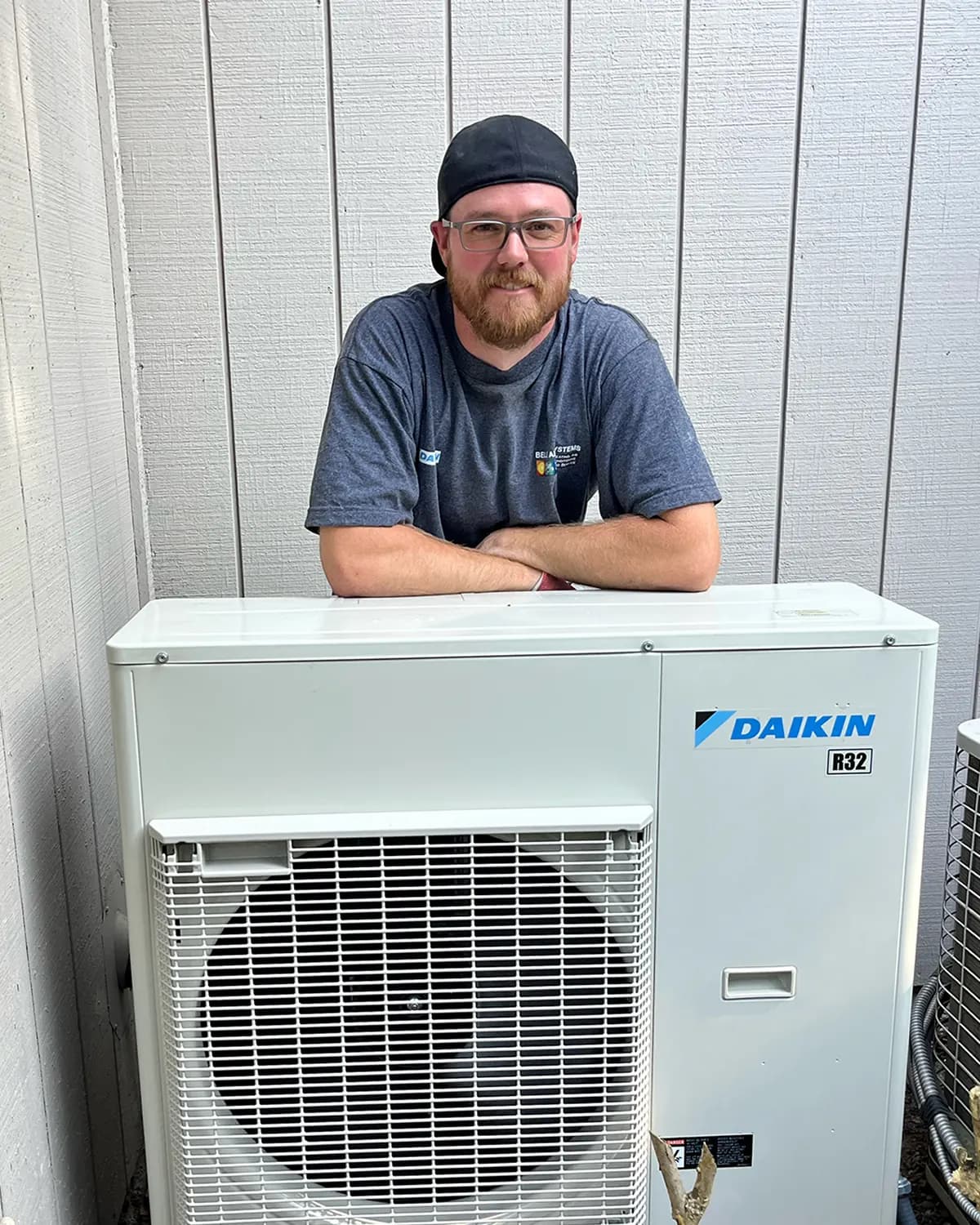 HVAC technician working on Daikin residential equipment.