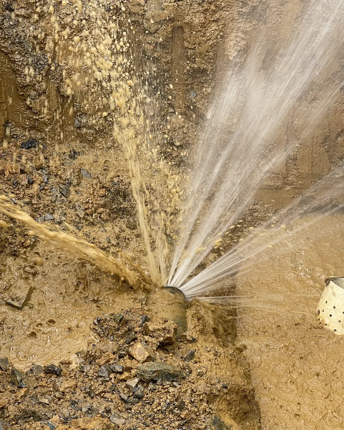 Burst pipe flooding residential property