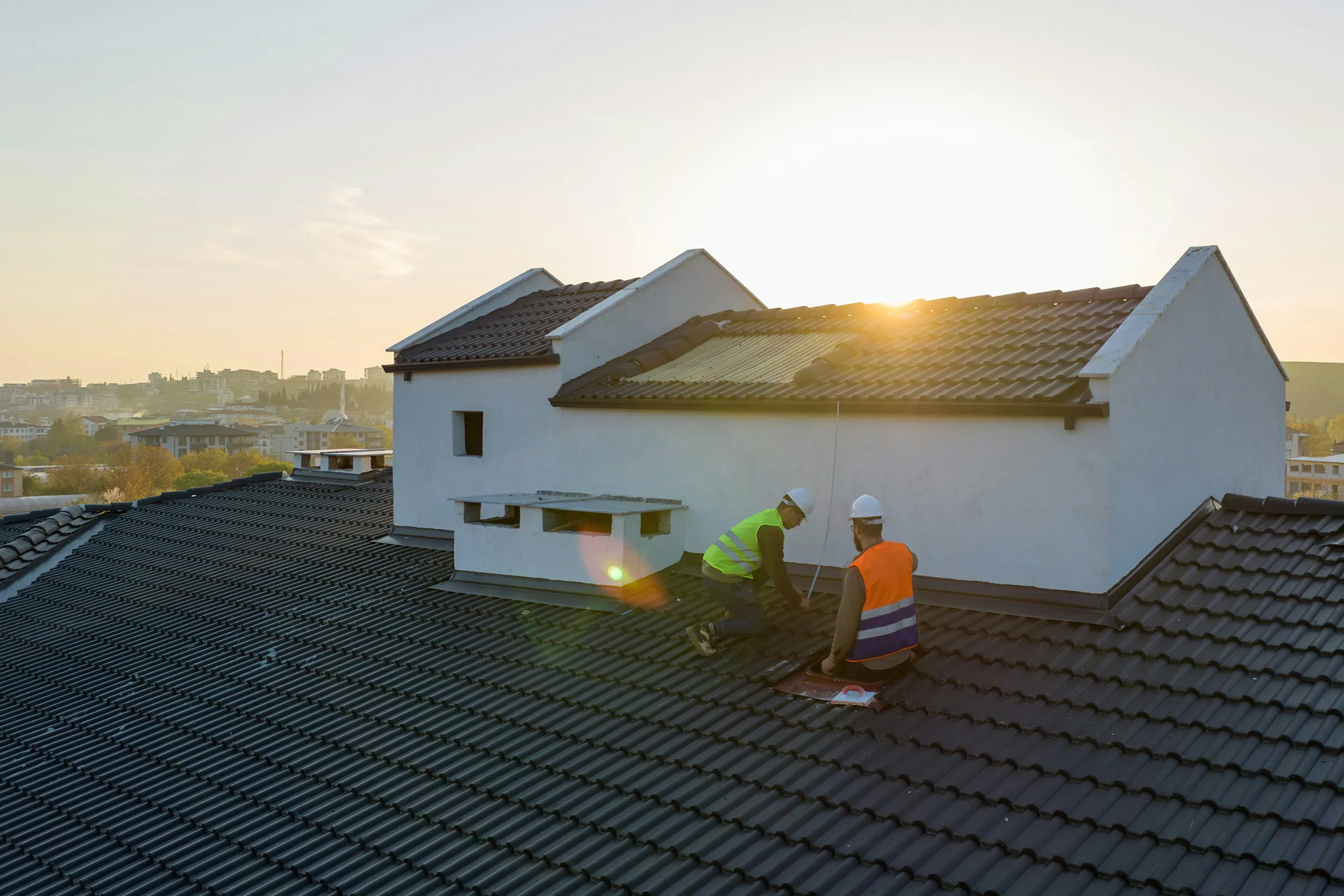 Roofing team working on a residential roof.