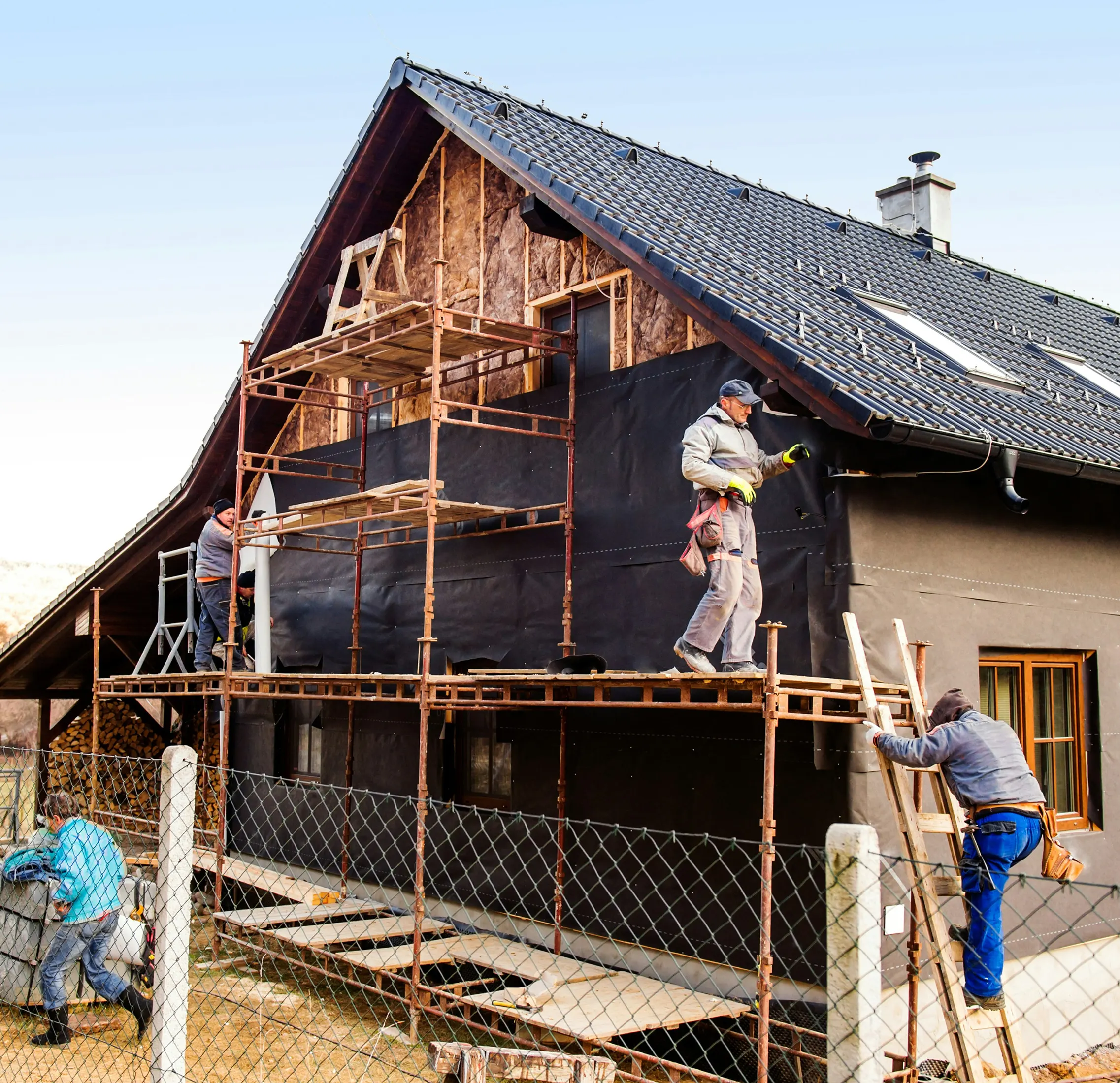 Roofing crew working on the exterior of a home.
