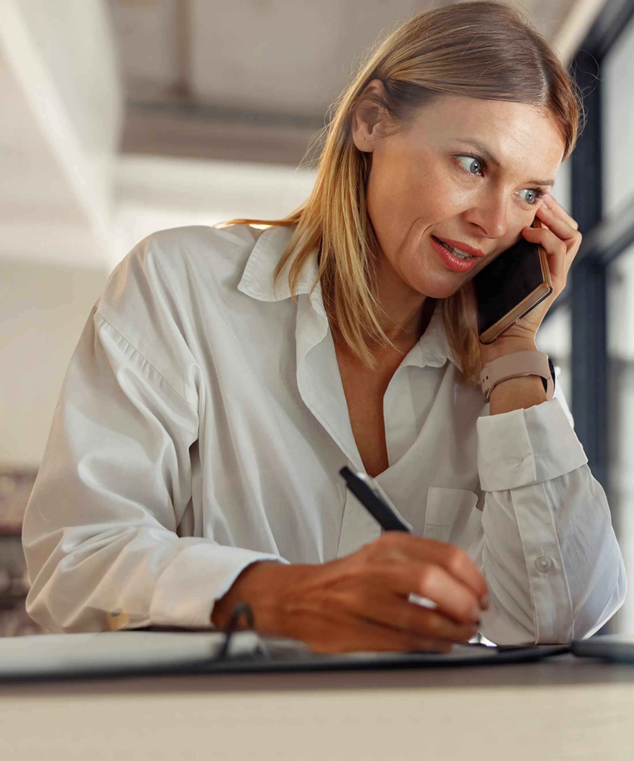 Office Admin reviewing a work order with a prospect on phone