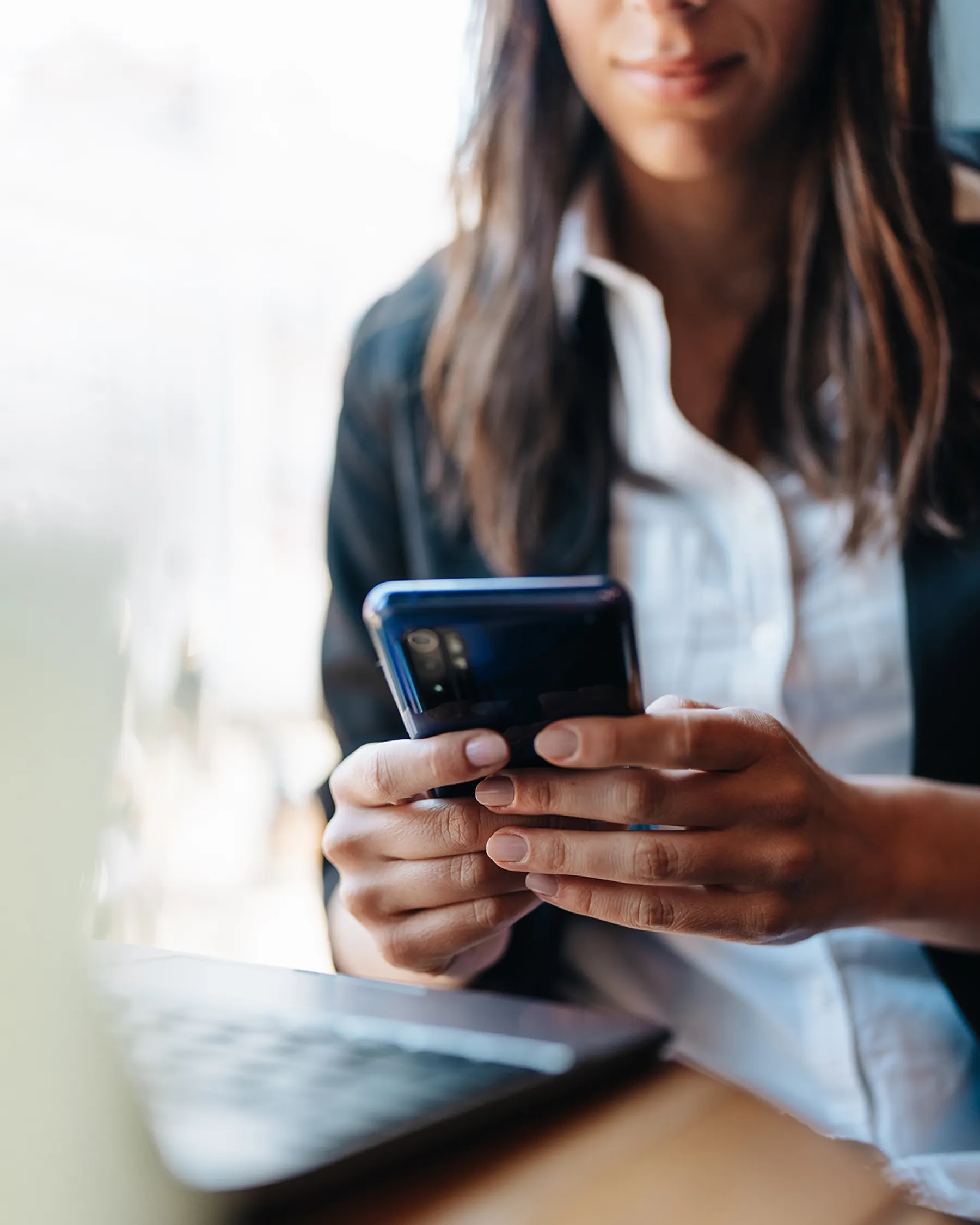 Woman reading a business’s reviews on her cell phone